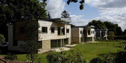 A trio of new builds sitting in the gardens of a demolished house from the 1930s. These houses maximise views into their gardens and passive solar gain.
