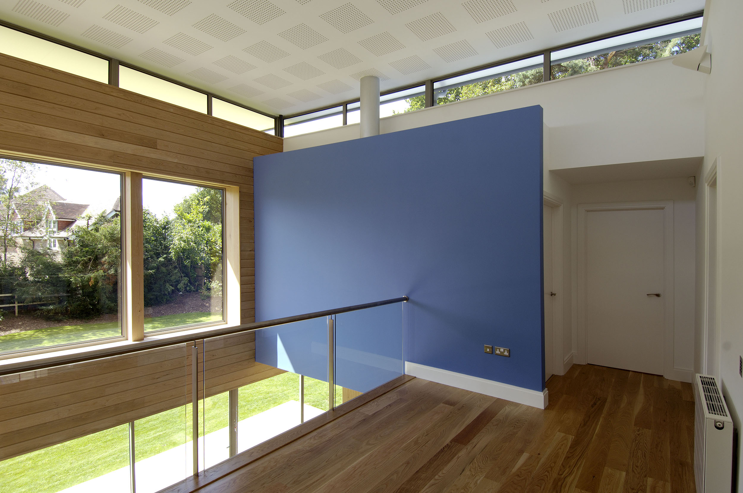 The first floor landing area providing additional living space with spectacular views down into the dining hall and out into the garden. The clerestorey windows provide sunlight morning and evening to animate the space.