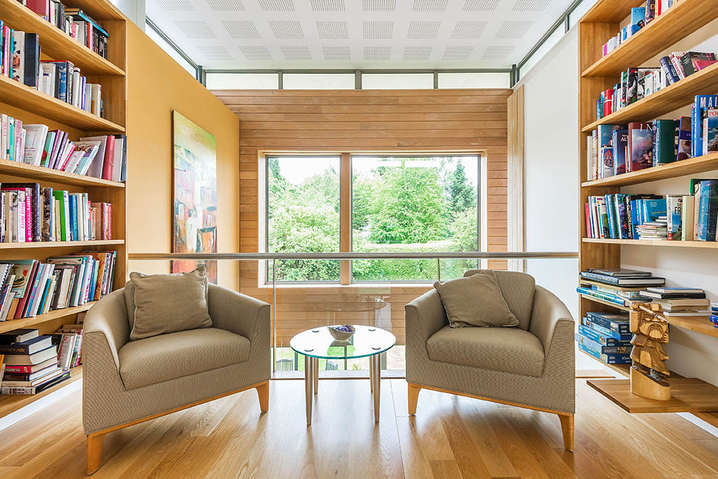 First floor landing space providing a small library area at the heart of the house.