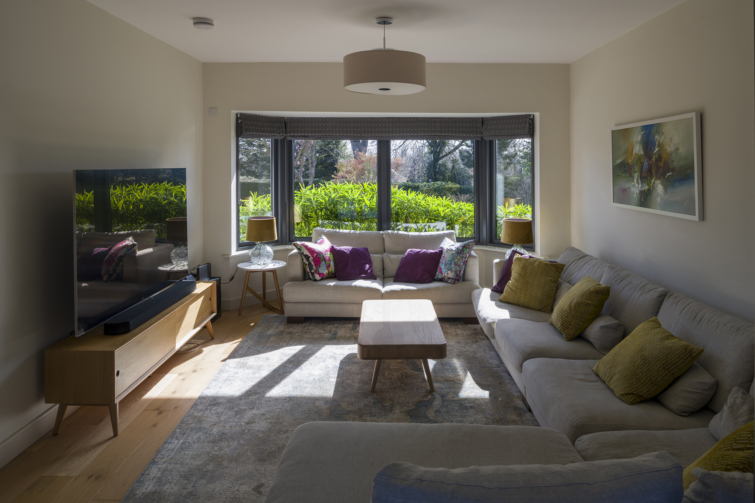 Penton Architects 0414_web dual aspect living room with new bay window to front letting light flood in.